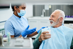 dentist explaining root canal in Waterford to patient