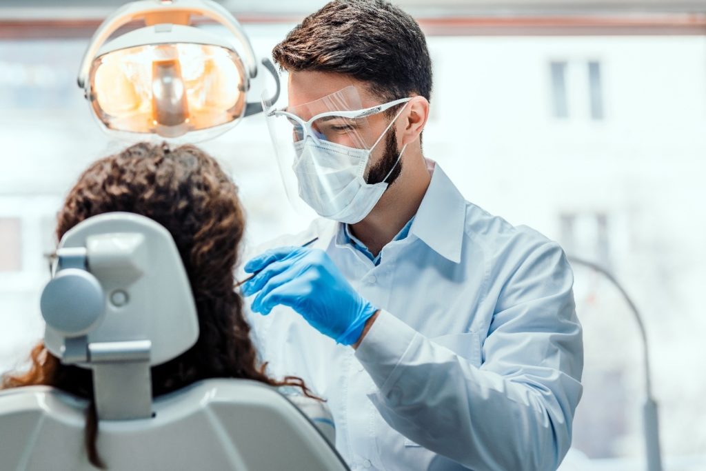 patients at dentist having dental crown placed 